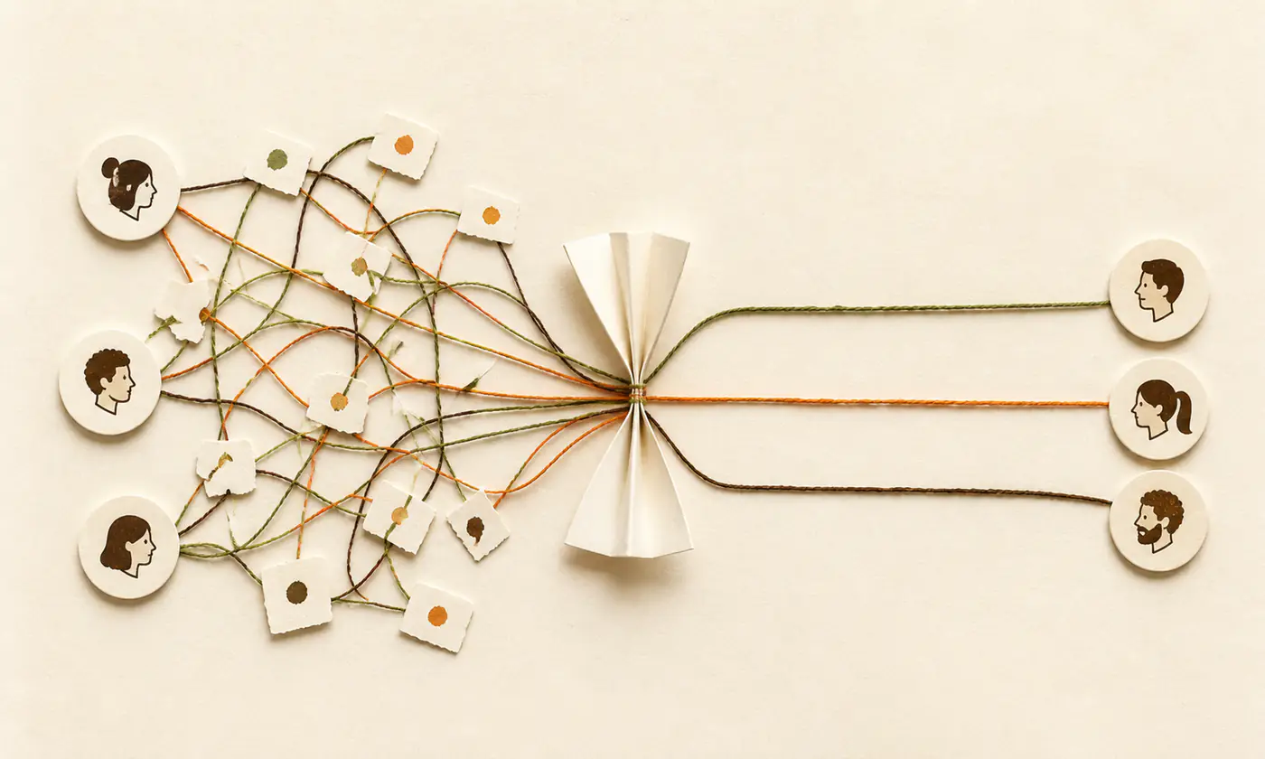 A tangle of coloured threads on the left is drawn through a single pinch and leaves as three straight lines, one to each person.